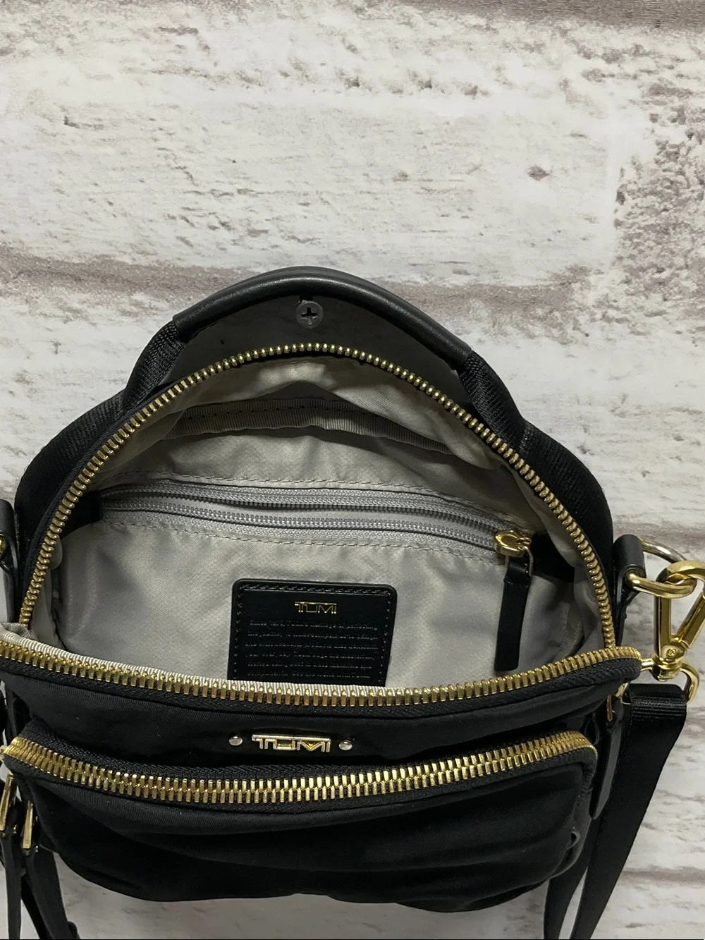 Tumi Black Nylon Crossbody with Gold Hardware Accents
